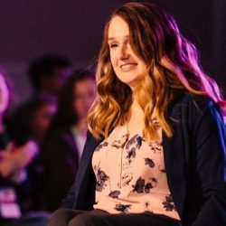 Wheelchair user Shannon modelling in a fashion show for wheelchair users