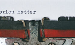 A typewriter has written Stories Matter - photo by Suzy Hazelwood